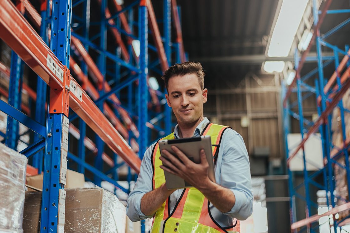 worker on tablet in fulfillment center