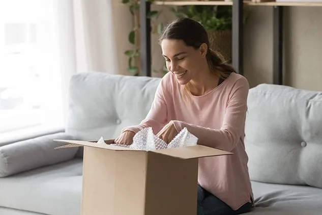 woman opening box