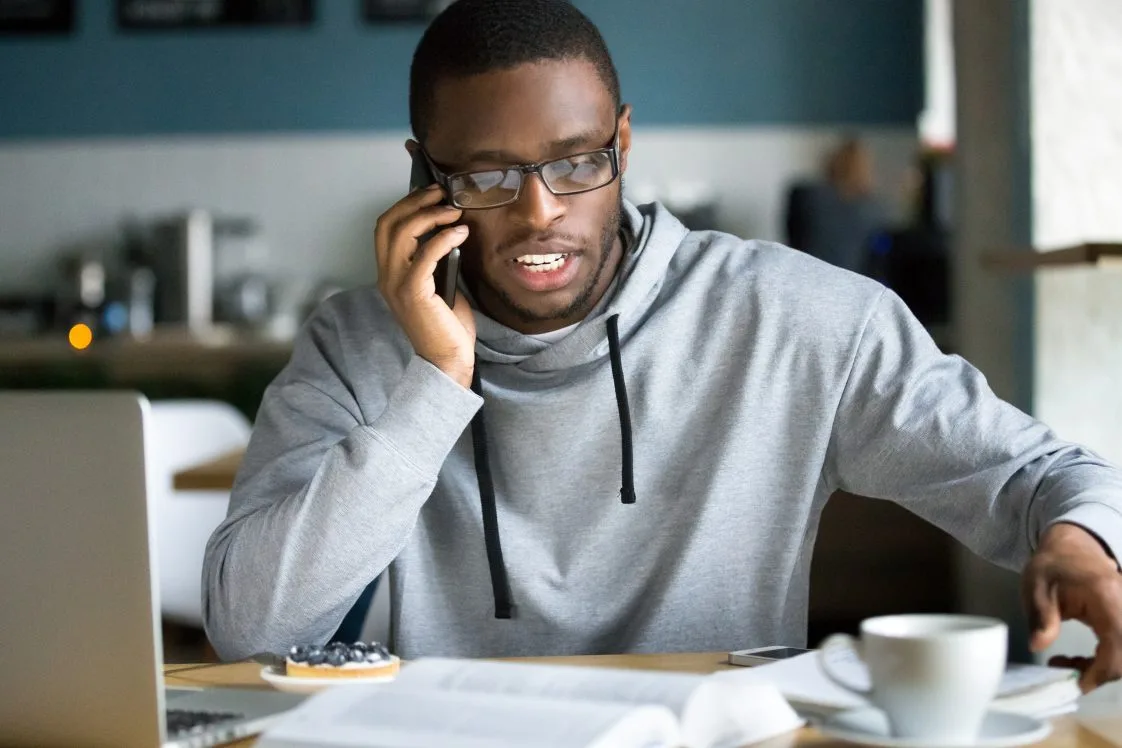 man on phone with customer service