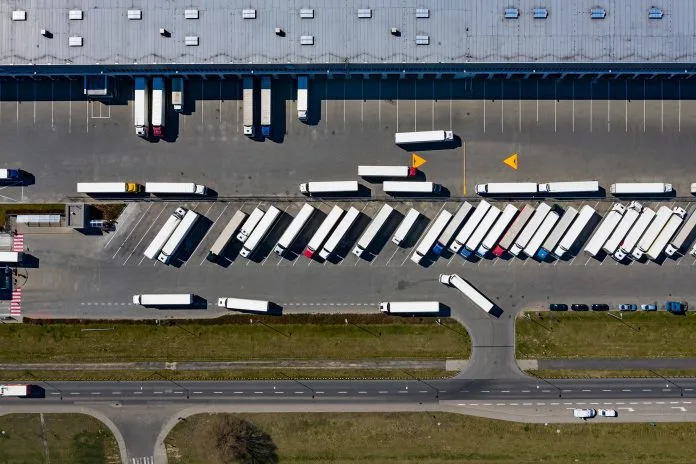 Aerial drone on trucks and logistic center.